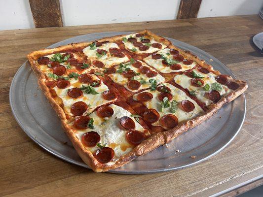 Angry Grandma Pizza - a grandma pizza with cupping pepperoni and hot honey drizzled on top