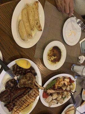 Meat and fish platters with lemon potatoes