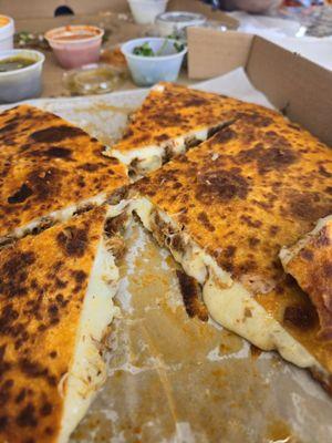 Pizzadilla with sauces in the back