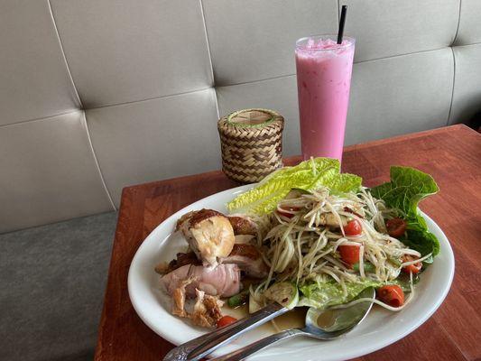 Papaya salad-Laos style, grilled chicken and sticky rice with iced pink milk .