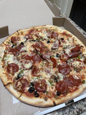 Medium supreme- brothers pizza- best pizza in Houston .