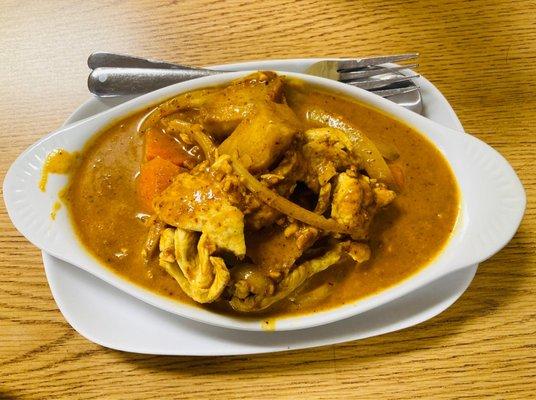 Massaman (Yellow) Curry: Yellow Curry with Potatoes, Onion, Carrots, Coconut Milk, and Roasted Peanuts with Chicken.