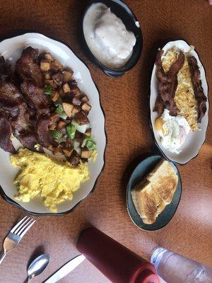 Scrambled eggs, bacon, Ardys potatoes, biscuit and gravy.  Eggs over medium, bacon, hash browns, sourdough toast.