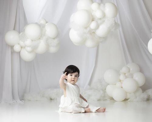 All white ethereal theme balloons for baby's first birthday