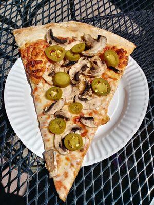 Ordered a slice with mushrooms and jalapenos, got an already cooked slice of cheese pizza with some sloppily arranged pickled jalapeno Rings