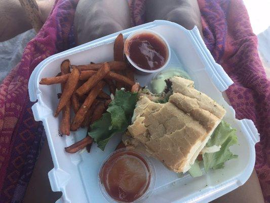 My HALF of a blackened fish sandwich and sweet potato fries. Split the meal with my husband.