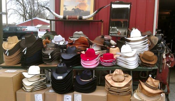 Selection of hats outside the small saddle shop.