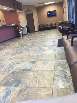 Clean and spacious  waiting room. Equipped with three flat screen tvs.