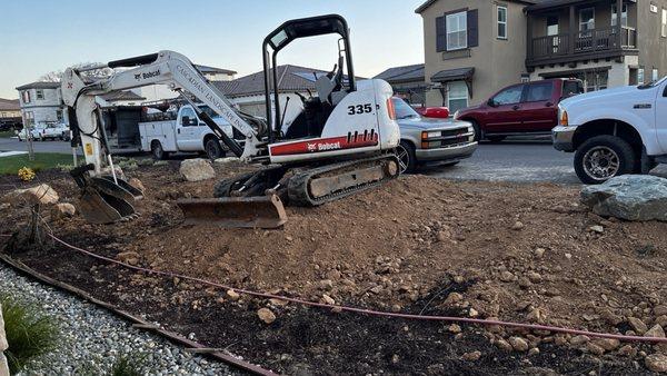 Working on the front yard landscape.