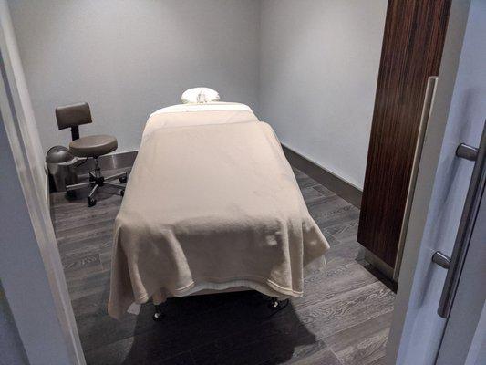 Massage room in the back with sliding pocket door for privacy