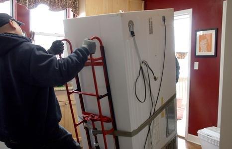 Jon removing a fridge from a lovely customers home