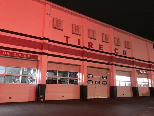 Briggs Tire Company in the soft glow of red neon.