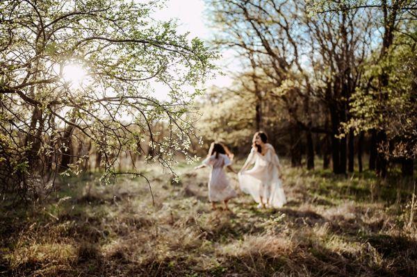 Mommy and daughter enjoy a trail walk in the Texas sunshine.