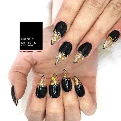 Full set of stiletto acrylic nails with French foil nail art