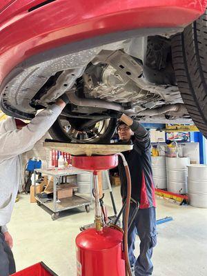 Members of our team performing a engine oil service.