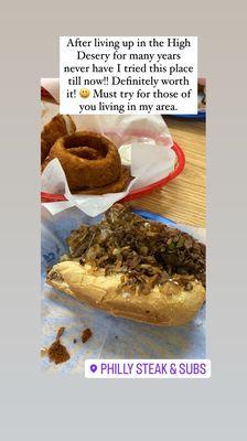 Philly Cheesesteak Sandwich and Onion Rings