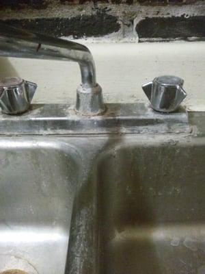 This is the sink that leaks under the plate but the pipes are too corroded for them to fix