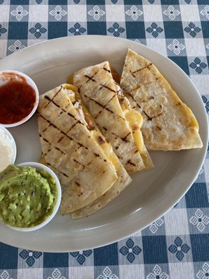 Quesadilla! Comes with salsa, guacamole, and sour cream. There is also a 4th slice not shown, as I had eaten it already lol.)