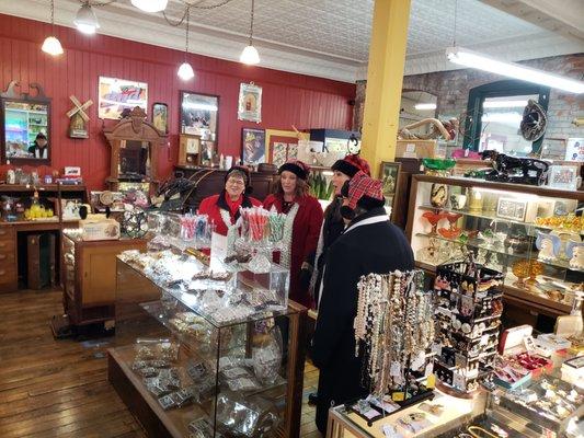 Carolers singing behind the candy counter during the annual DIckens Festival.