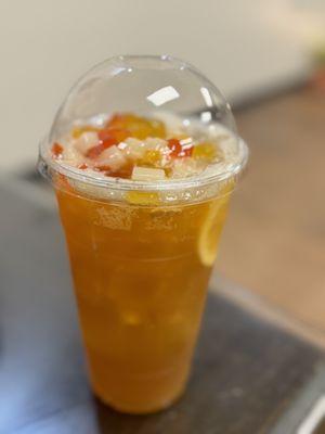 Passion fruit pineapple bubble tea with crystal boba and rainbow jelly