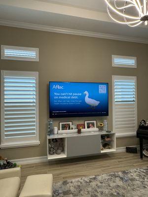 Plantation shutters, top, transom , and lower window .