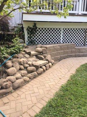 A Retaining wall and steps to bio fall