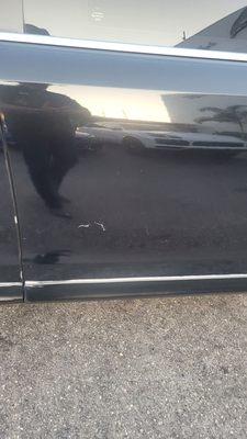 Dent and more scuffs on side of limo