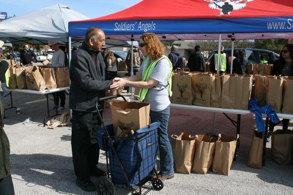 Veteran receiving groceries at a Military and Veteran Food Distribution.