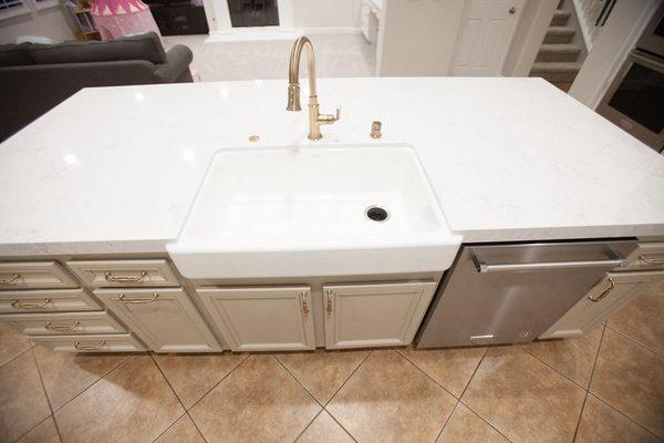 Kitchen refinish with large quartz island and elegant Brizo plumbing fixtures