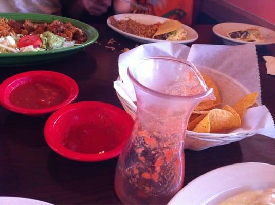 Salsa carafe, salsa bowls, chips. Mostly eaten. Good.