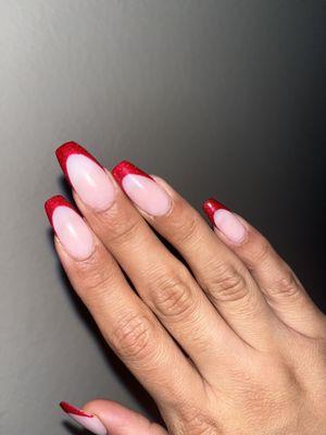 Hand that showcases the newly "installed" nail (middle finger) which is wider and more rounded than other nails previously done.