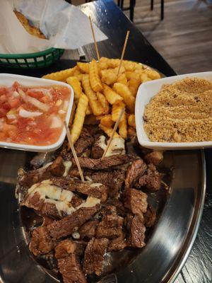 Picanha dinner with French fries, farofa and their salsa