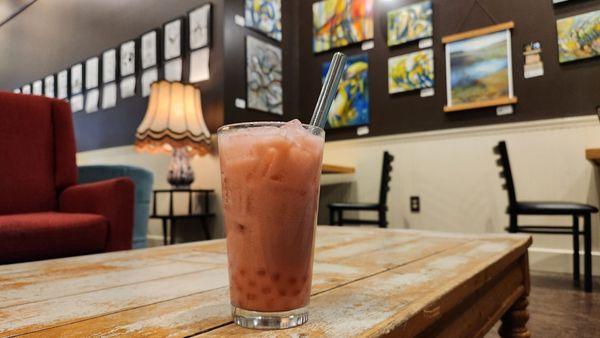 Raspberry bubble tea with pomagranate popping boba