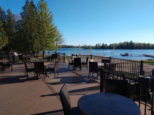 Lakeside deck seating behind restaurant