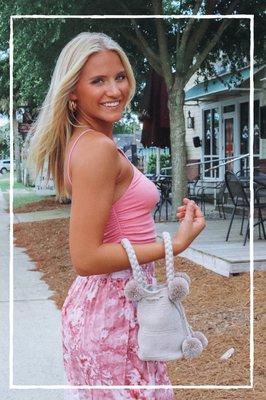 Love this mini pom pom handbag! It holds my keys, wallet, and phone!