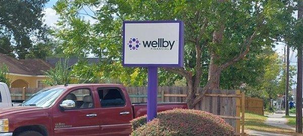 Outdoor signage of Wellby Financial in Park Place