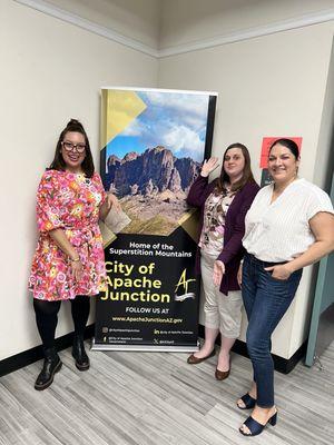 My friends and I posing in front of the city signage