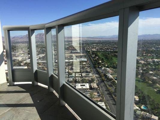 Glass railing cleaning on the 30th floor condo