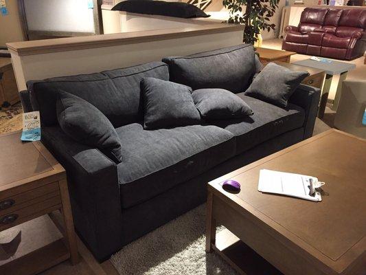 Stylish, customizable contemporary sofa. Very comfortable with feather wrapped cushions.