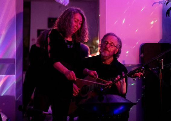 Dr. Gigi Turner and classical guitarist Dave Patrick harmonizing during a sound bath in Colorado Springs, CO