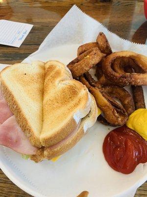 The club sandwich  with overcooked onion rings