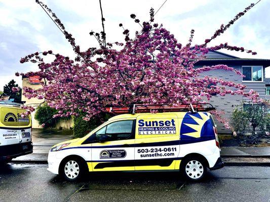 Sunset Heating & Cooling van in the springtime.