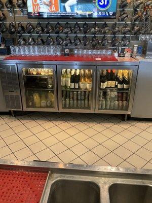 Wine and other drinks behind the bar in main taproom.