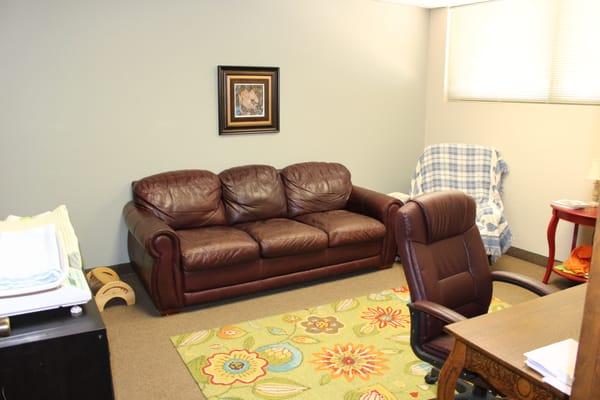 Consult rooms at the Arizona Breastfeeding Center.  Each room has comfortable furniture and is set up like a living room.