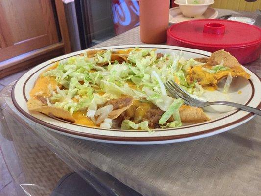 Bean & cheese nachos with lettuce.