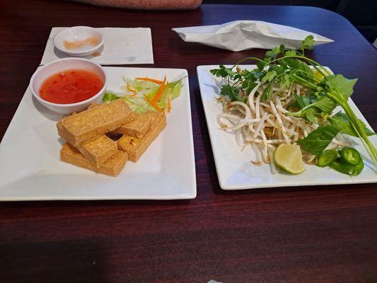 Fried tofu appetizer and a big pile of beans sprouts, herbs, limes, and jalapenos.