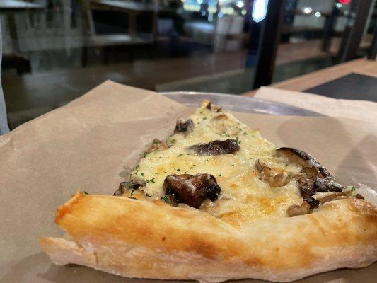 Single slice of mushroom pizza