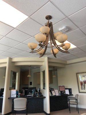 This is the check In counter, lighted up by this chandelier.