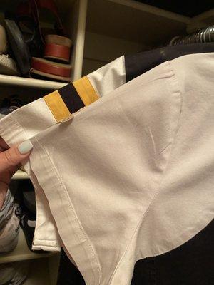 The shirt in back with the black and yellow stripes, is what color my shirt was prior to going to Old Town Dry Cleaners.