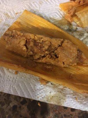 This is what their pork tamales look like, they immediately fell apart when opened from their wrapper . The quality is not there ...